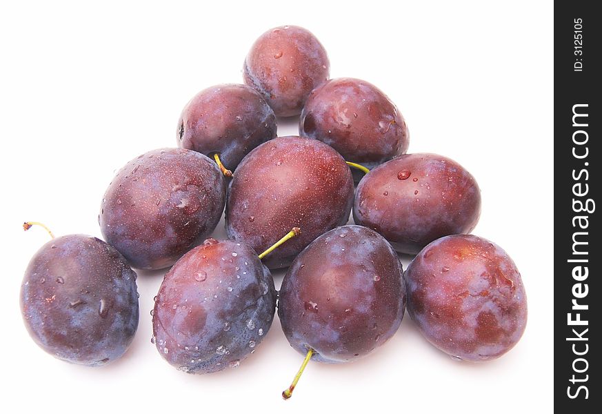 Fresh plums isolated over white background