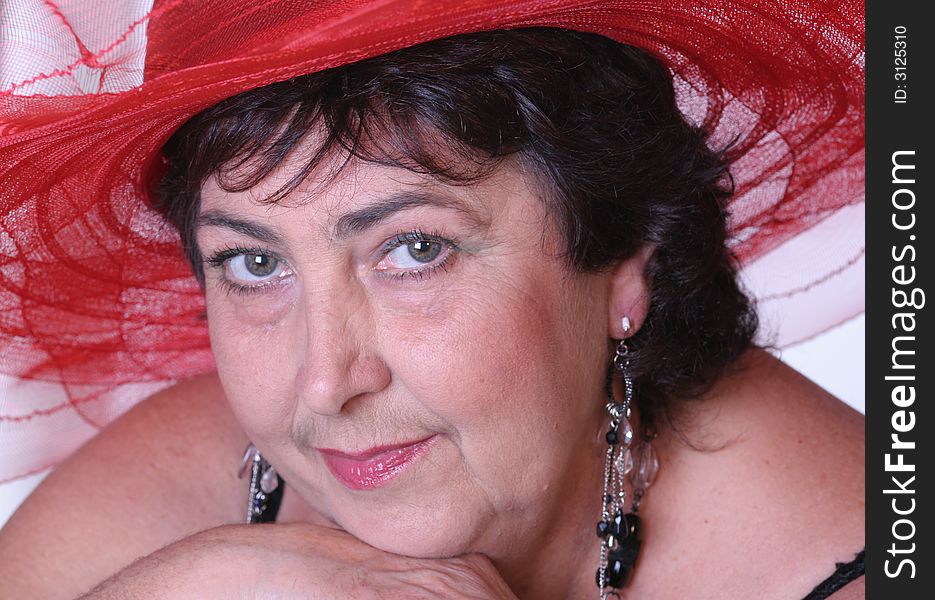Portrait of a woman in red hat close-up