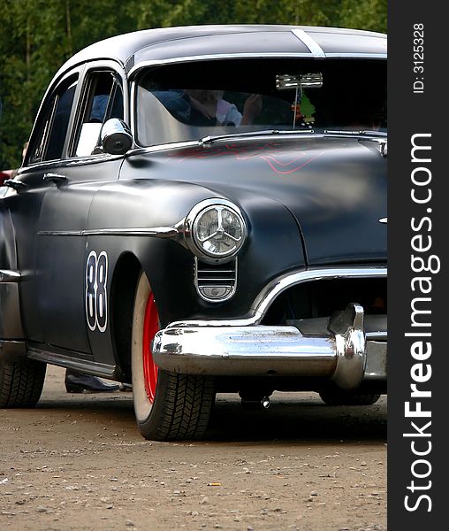 Number 88, an all black race car from the 50s. Number 88, an all black race car from the 50s.