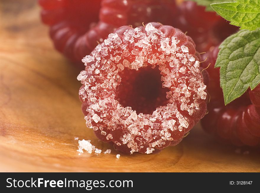 Plate with raspberries, sugar and mint. Plate with raspberries, sugar and mint