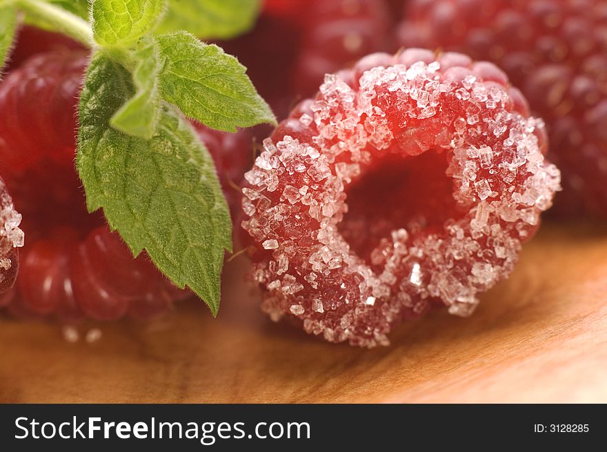 Plate with raspberries, sugar and mint. Plate with raspberries, sugar and mint