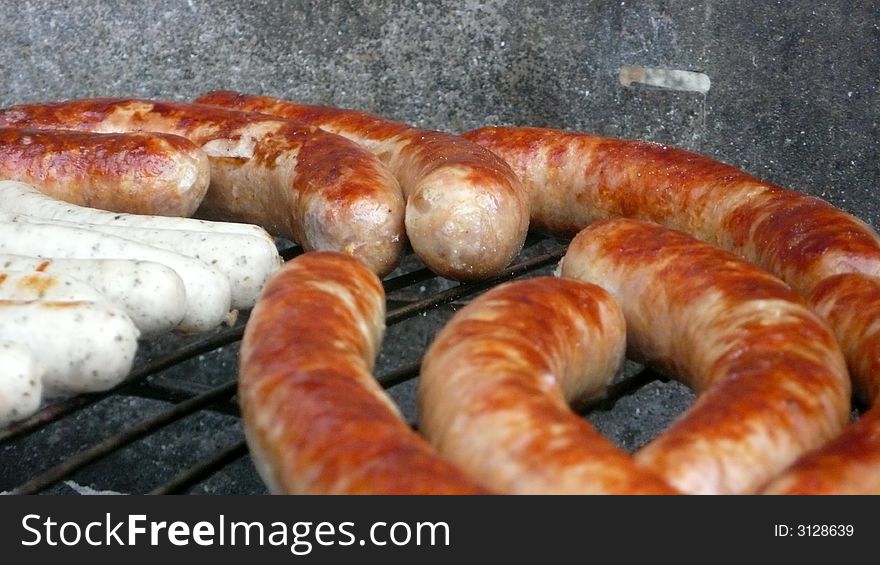 Closeup of sausages on a grill
