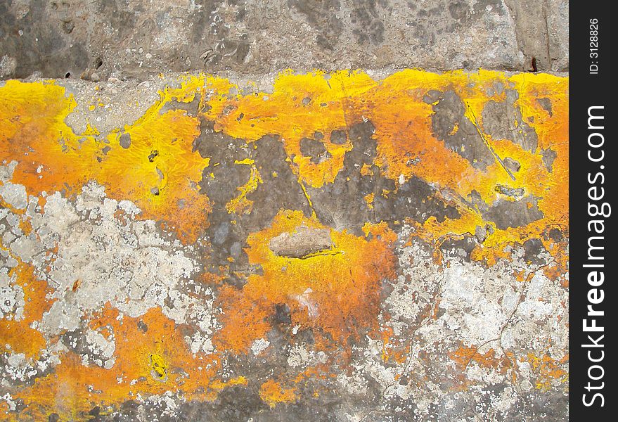 Old yellow paint on eroded concrete. Old yellow paint on eroded concrete
