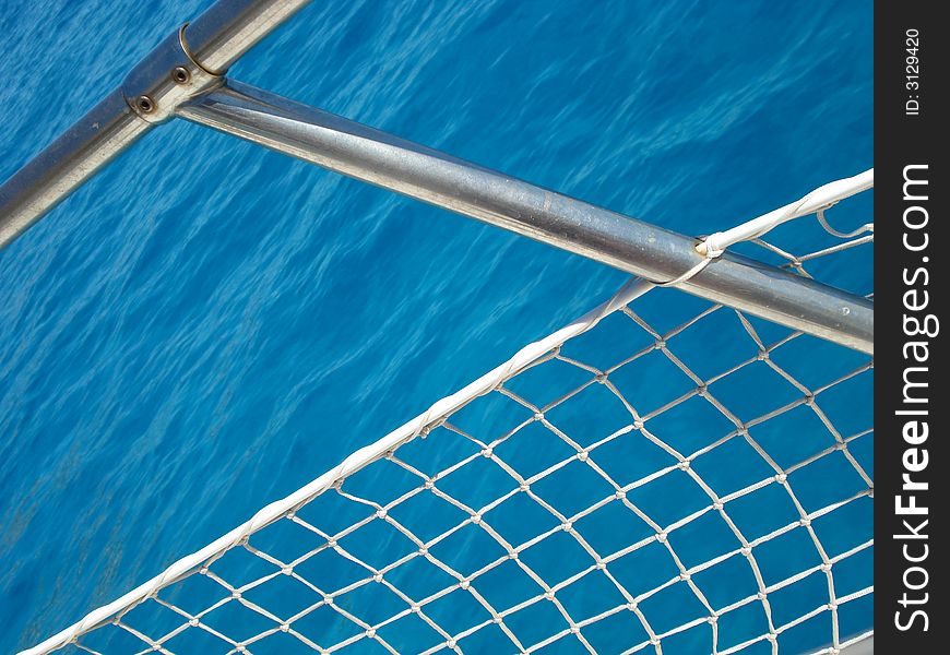 Datail of handrail on a boat sailing in a blue sea. Datail of handrail on a boat sailing in a blue sea