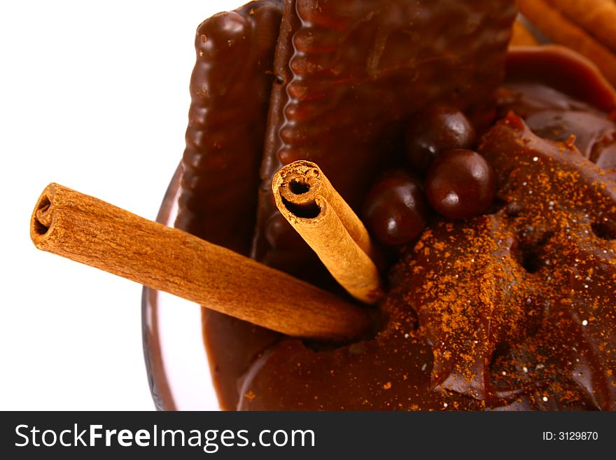 A ripe brown cinnamon in chocolate dipping sauce. A ripe brown cinnamon in chocolate dipping sauce.