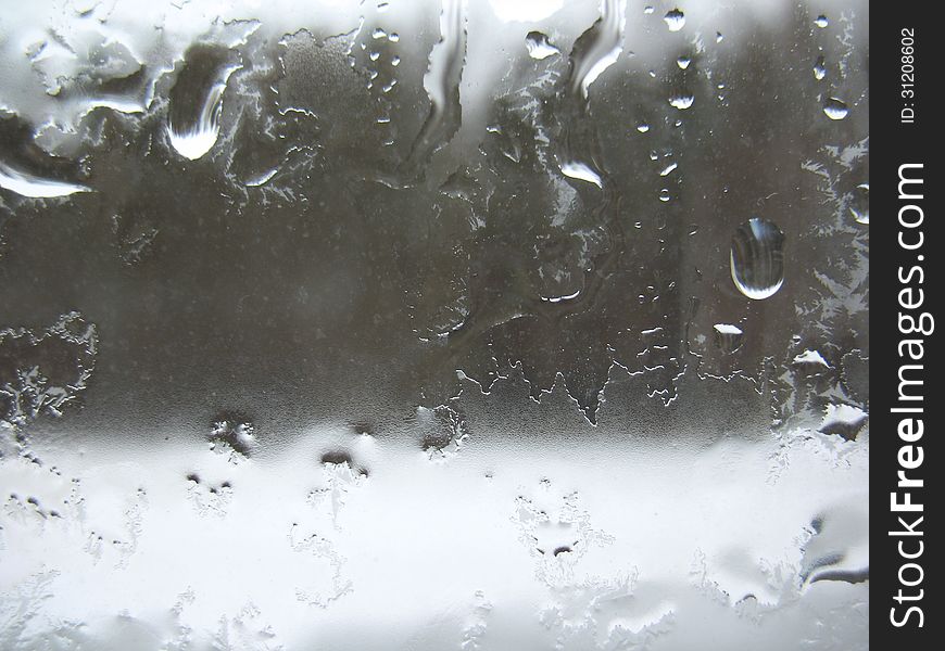 Window glass and rain drops