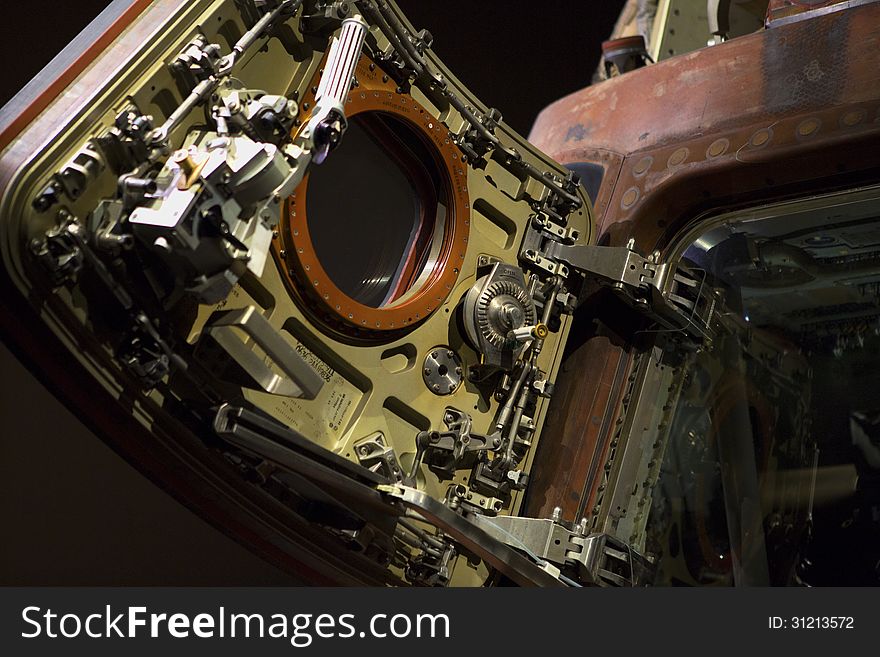 Detail image of the hatch of the Apollo 8 Command Module on display at the Kennedy Space Center. Image shows detail of the hatch door and some of the interior of the capsule. Detail image of the hatch of the Apollo 8 Command Module on display at the Kennedy Space Center. Image shows detail of the hatch door and some of the interior of the capsule.