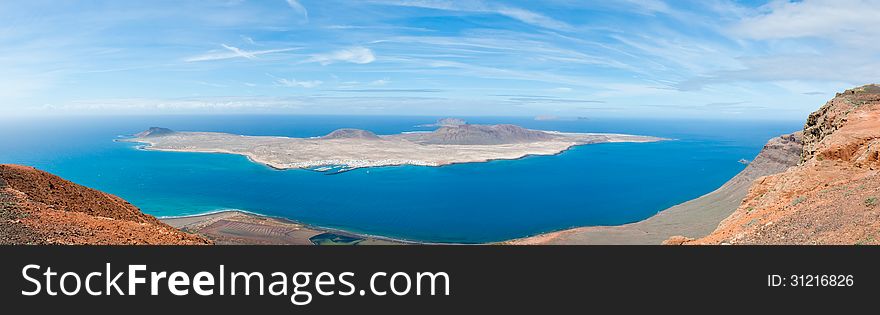 Beautiful isle La Graciosa panoramic view from Lanzarote. La Graciosa is a small island of the Canary Island, with its 29 km. Beautiful isle La Graciosa panoramic view from Lanzarote. La Graciosa is a small island of the Canary Island, with its 29 km