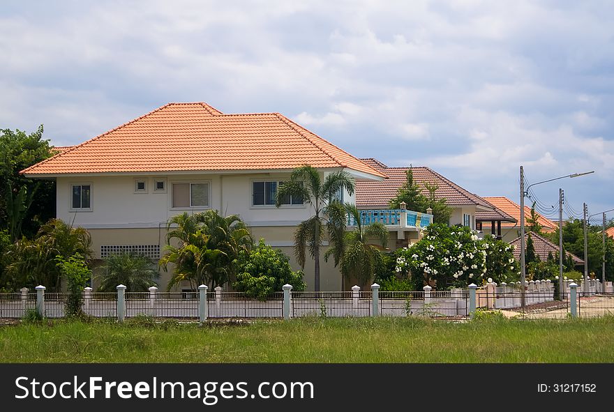 Pretty homes and gardens against the summers sky