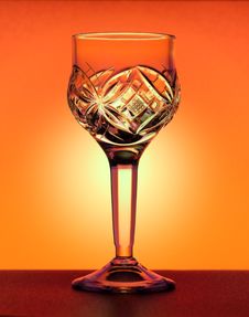 Small Liqueur Glass At The Orange Gradiend Background Royalty Free Stock Photography