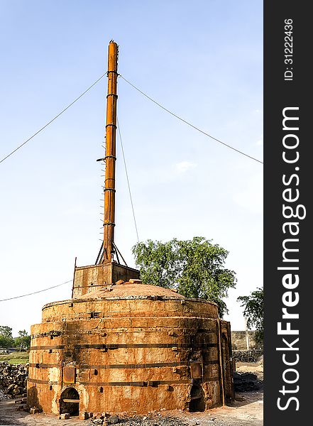 An old refractory furnace with chimney.