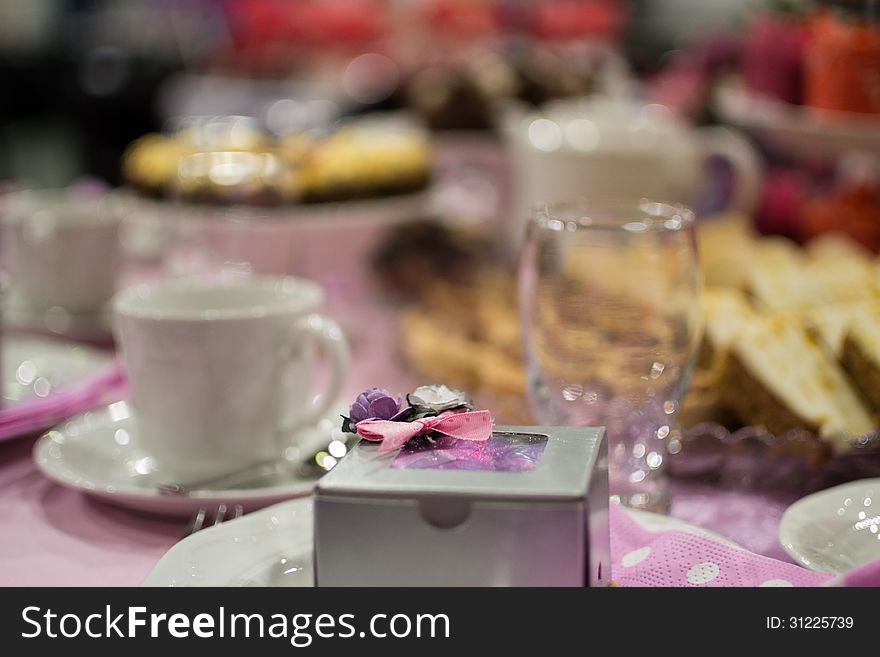 Cake box with bow pink theme at dinning table