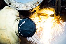 Oxygen-cutting Operator Cuts Bolts In A Cell With Water. Stock Image Oxygen-cutting Operator Cuts Bolts In A Cell With Water. Stock Image