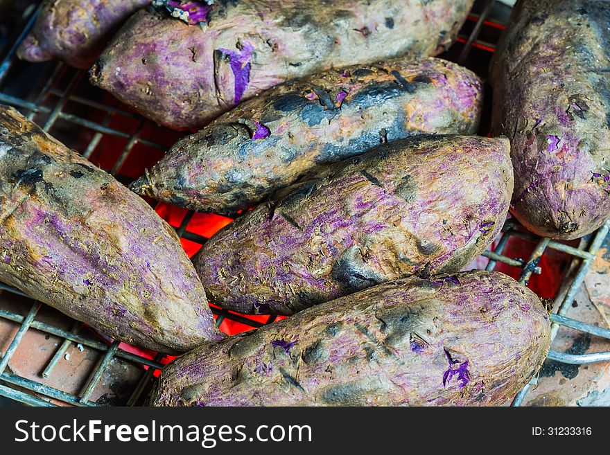 Grilled cassava on the steel grill