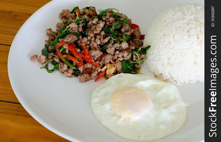 Rice with stir fried hot and spicy pork with basil. Rice with stir fried hot and spicy pork with basil