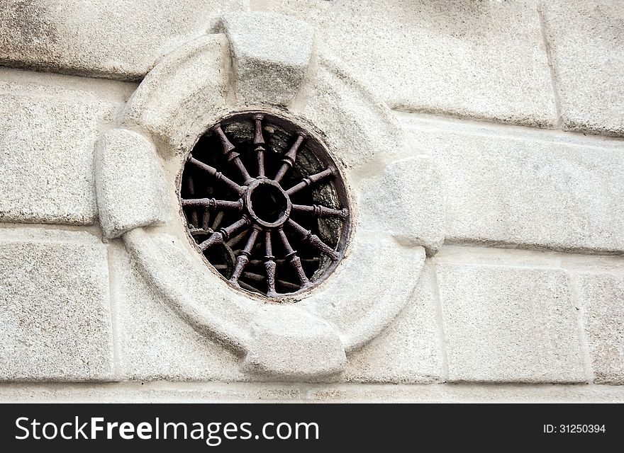 Round window on a building in Toledo Spain