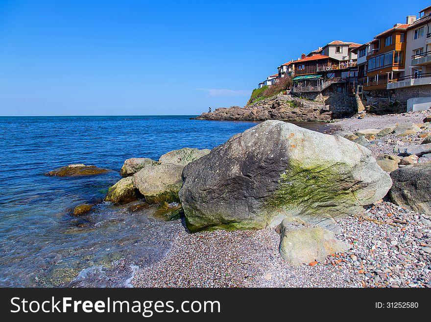 Seascape of the ancient Bulgarian town of Sozopol with rocks in the foreground. Seascape of the ancient Bulgarian town of Sozopol with rocks in the foreground