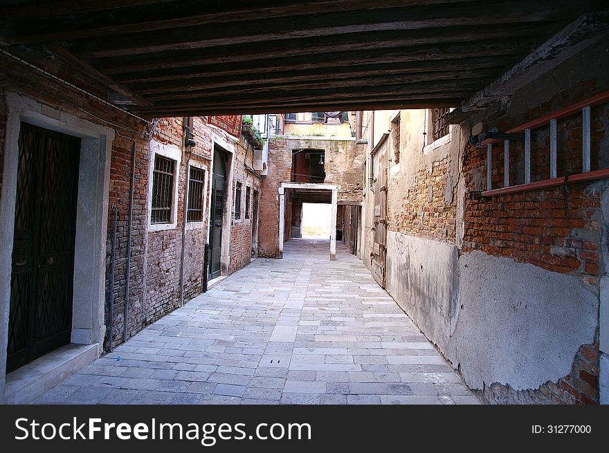 A back alley walk way in Venice on a warm day. A back alley walk way in Venice on a warm day