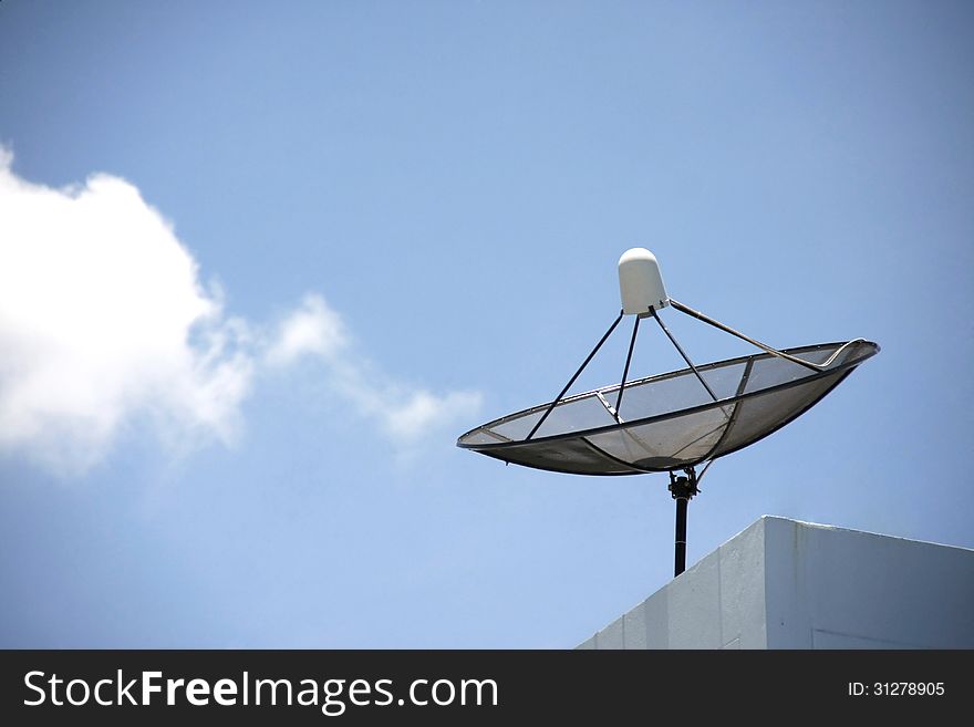 Black Satellite dishes with blue sky