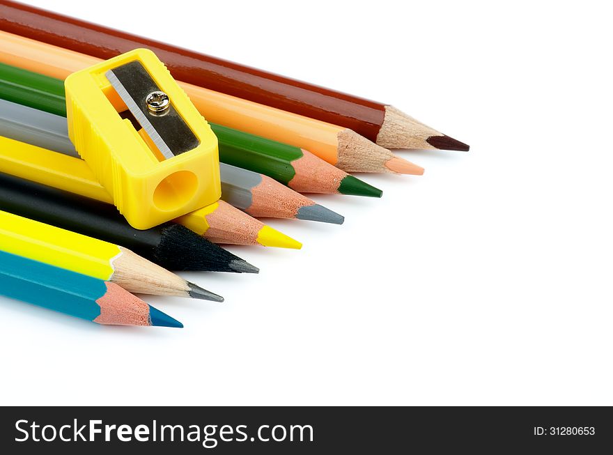 Arrangement of Sharp Lead and Colored Pencils with Pencil Sharpener isolated on white background. Arrangement of Sharp Lead and Colored Pencils with Pencil Sharpener isolated on white background