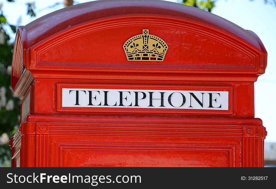 Retro style	red telephone booth close-up