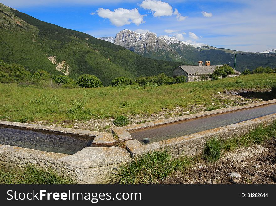 Little fountain in the mountain landscape