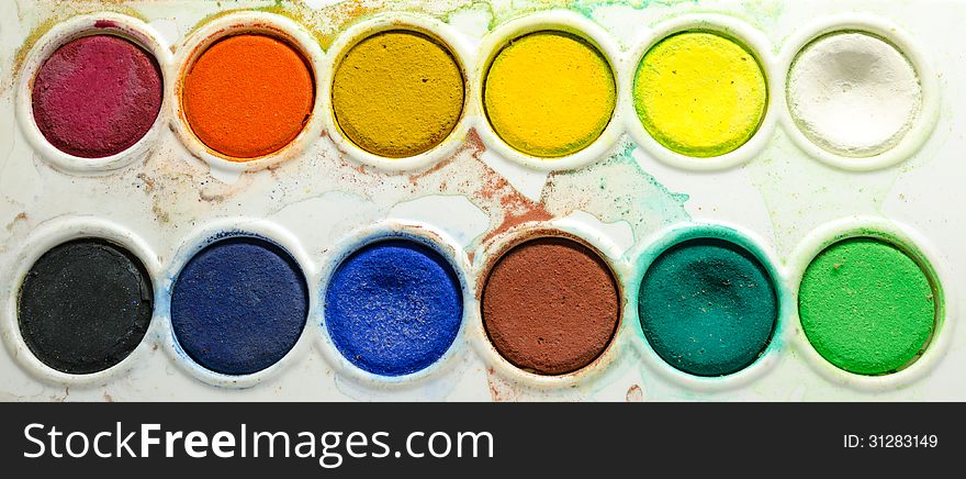 A dirty water color palette isolated on white background