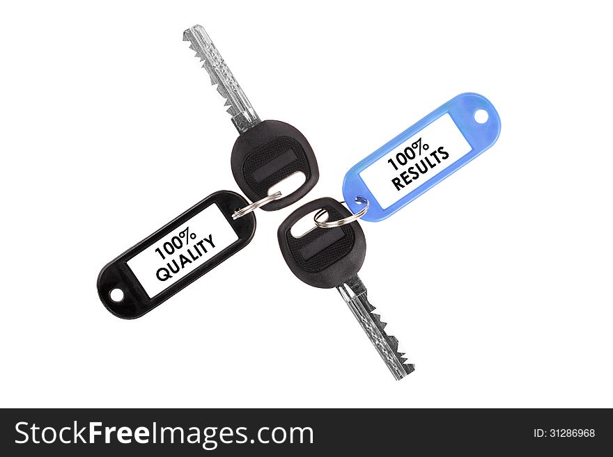 Keys on a white background. Keys with plastic tag. Keys on a white background. Keys with plastic tag