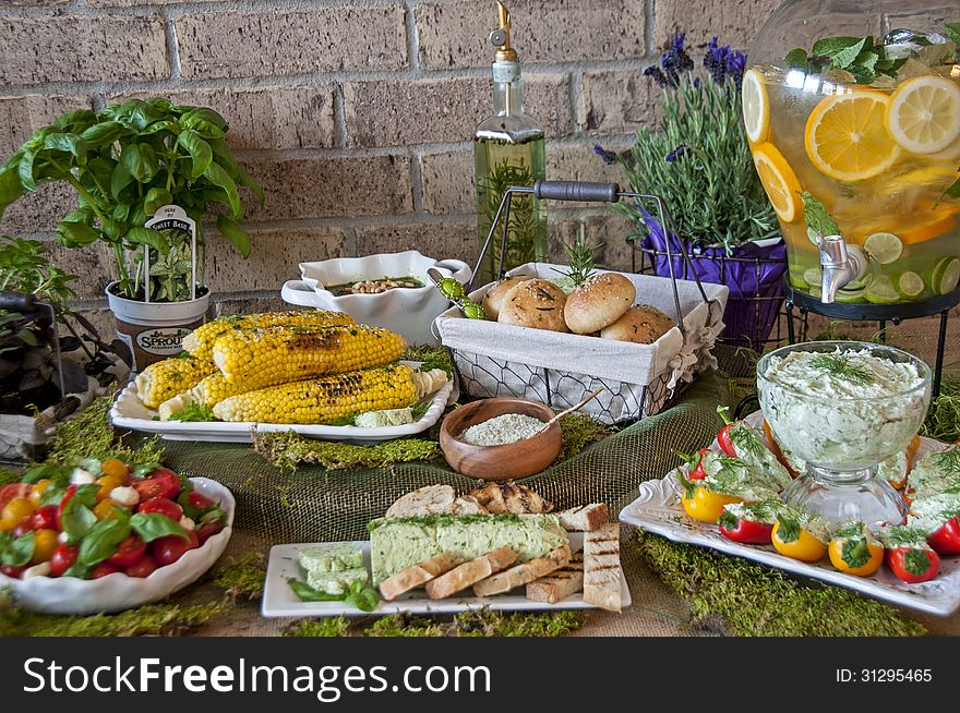 This is a food spread that focused on herbs. With herb butter, corn with herb salt, herb rolls, herb cream cheese. This is a food spread that focused on herbs. With herb butter, corn with herb salt, herb rolls, herb cream cheese