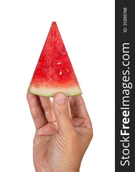 Close up vertical shot of a hand holding the perfect slice of delicious watermelon. Isolated on a white background. Close up vertical shot of a hand holding the perfect slice of delicious watermelon. Isolated on a white background.