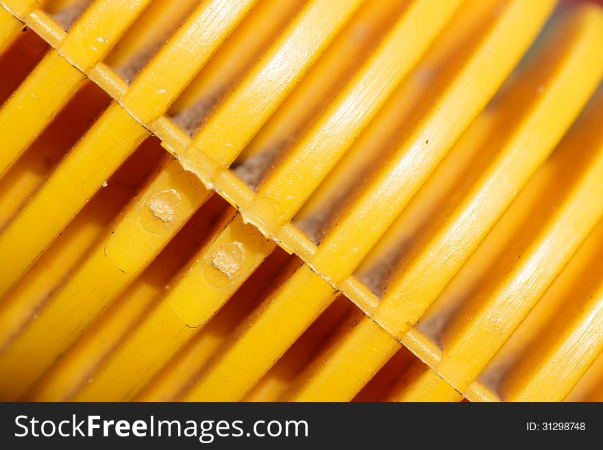 Yellow plastic background. Shiny plastic.