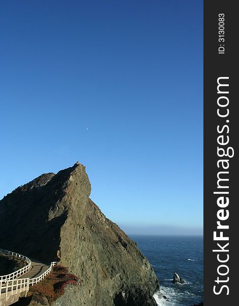 Cliff peak on the ocean with the moon. Cliff peak on the ocean with the moon