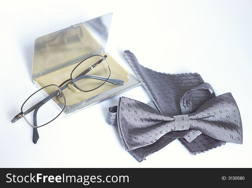Common business composition with bow tie and glasses. Common business composition with bow tie and glasses