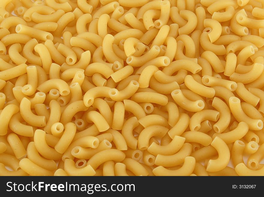 Yellow uncooked noodles -background, texture