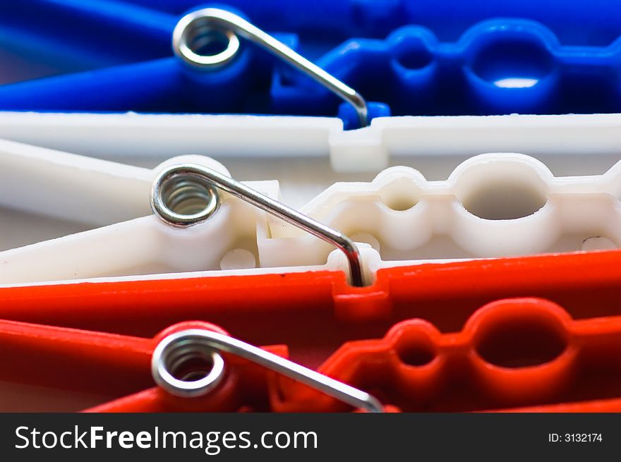 Close up of red white and blue clothes pegs