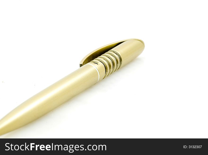 Golden plastic pen on white background.