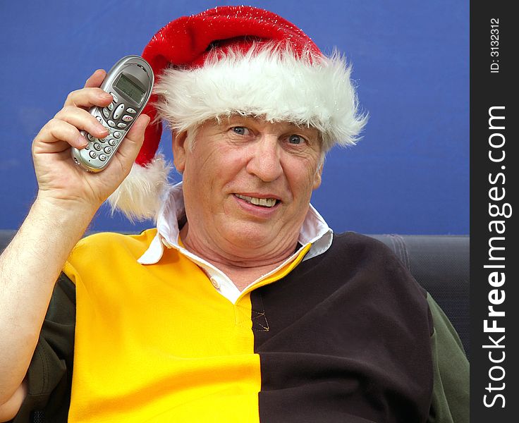 Mature male with telephone at christmas