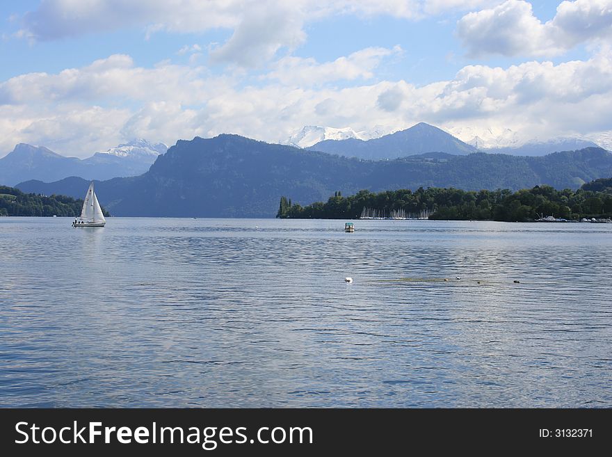 A sailboat on Lake Lucerne, Switzerland. A sailboat on Lake Lucerne, Switzerland.