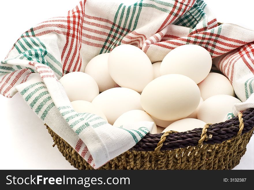 A basket of eggs on white background