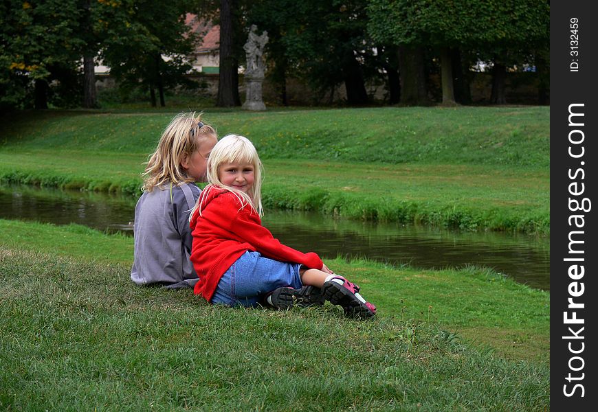 Children sitting and relaxing in the park. Children sitting and relaxing in the park