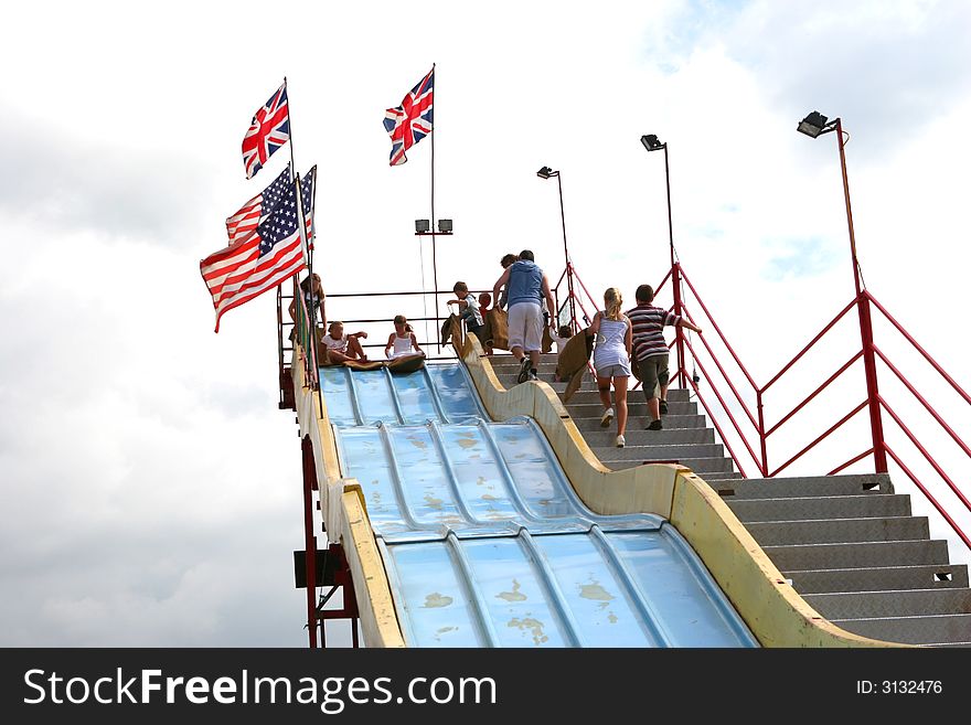 Children have fun on the giant slide. Children have fun on the giant slide