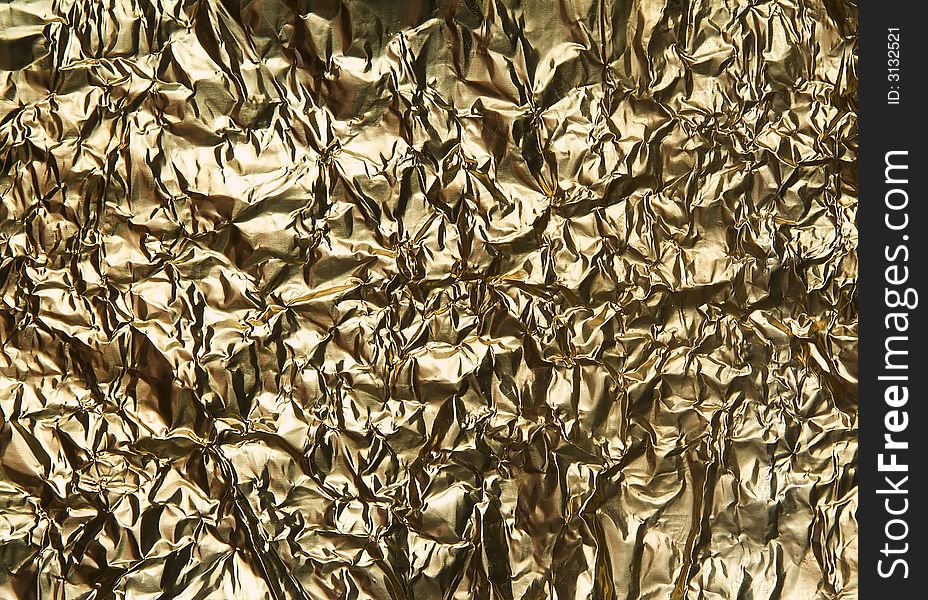 Very wrinkled golden metal background. Very wrinkled golden metal background