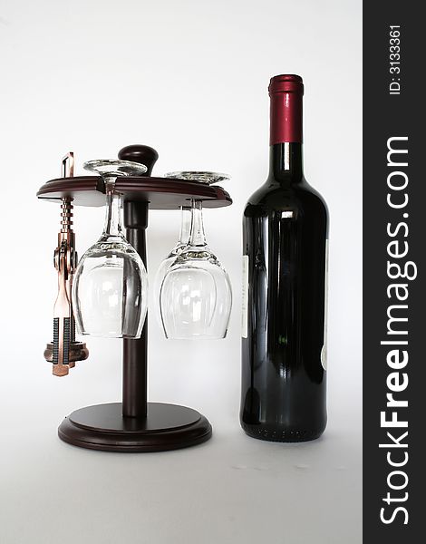 Red wine and an corkscrew isolated on a white background. Red wine and an corkscrew isolated on a white background