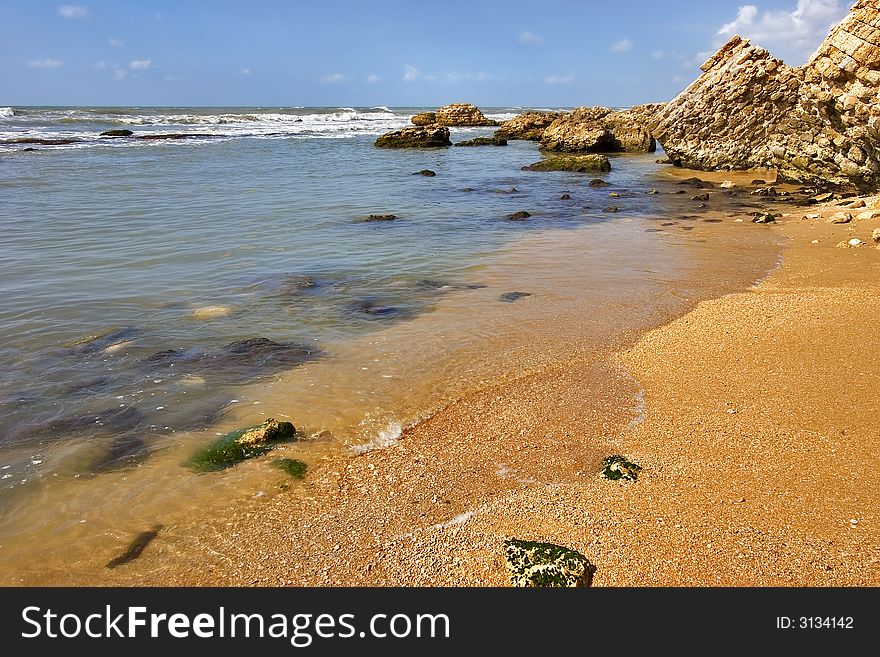 Coast of Mediterranean sea with big stones in water. Coast of Mediterranean sea with big stones in water