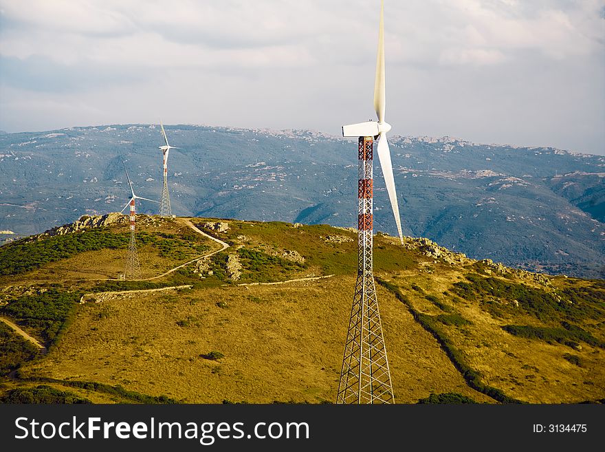 Environmental conservation: wind turbines against the sunset