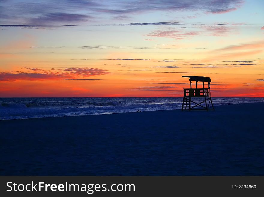 Sunset at the beach with life guard stand. Sunset at the beach with life guard stand