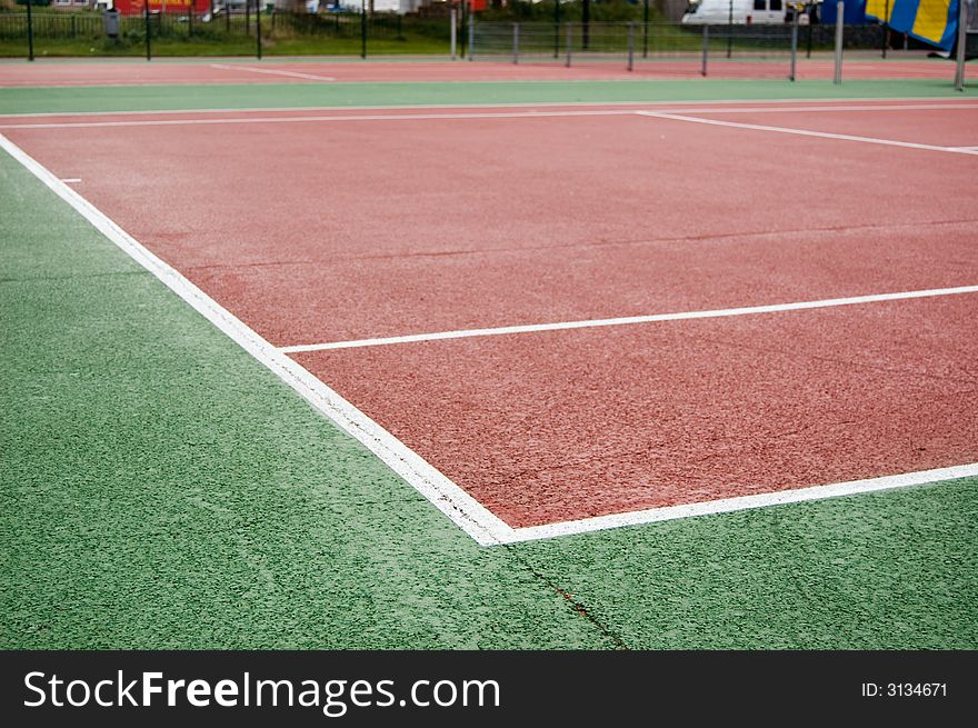 Tennis court with a second on the background