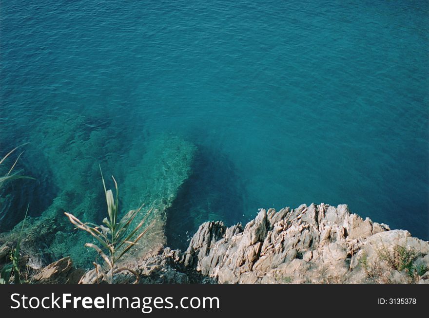 Scenic view of sea water off a cliff of the Cinque Terre, Italy. Scenic view of sea water off a cliff of the Cinque Terre, Italy