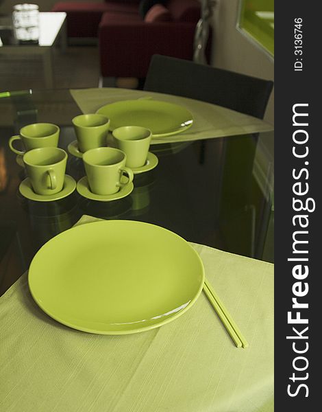 Green dinnerware on round table