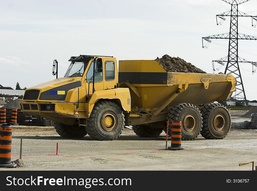 Very large dump truck at a construction site. Very large dump truck at a construction site.